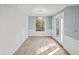 Well-lit dining room with modern lighting, fresh paint, and luxury vinyl floors at 4126 N Gloucester Pl, Atlanta, GA 30341