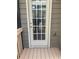 Exterior shot of a back porch with wood paneling and view of the apartment complex at 5027 Bayrose Cir # 27A, Atlanta, GA 30344