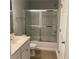 Bathroom with a shower-tub combo, a large mirror, and a white vanity sink at 5027 Bayrose Cir # 27A, Atlanta, GA 30344