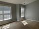 This bedroom features two large windows providing plenty of natural light at 5027 Bayrose Cir # 27A, Atlanta, GA 30344