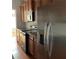 Bright kitchen featuring stainless steel appliances, wooden cabinets, and a built-in microwave for modern cooking at 5027 Bayrose Cir # 27A, Atlanta, GA 30344