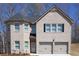 Charming two-story home with a two-car garage, a front door, and a beautiful brick exterior at 637 Egrets Landing #51, Covington, GA 30014