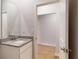 Bathroom vanity featuring granite counters and white cabinets at 637 Egrets Landing #51, Covington, GA 30014