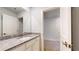 Bathroom with granite countertop vanity, undermount sink, and large mirror at 637 Egrets Landing #51, Covington, GA 30014