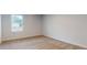 Bedroom with neutral carpet, walls and a large window at 637 Egrets Landing #51, Covington, GA 30014
