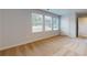 Bedroom featuring multiple windows offering natural light, plush carpet, and ample closet space at 637 Egrets Landing #51, Covington, GA 30014