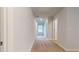 Hallway featuring neutral walls, carpet and doors, and natural light at 637 Egrets Landing #51, Covington, GA 30014