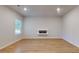 Spacious living room featuring hardwood flooring, neutral walls and recessed lighting at 637 Egrets Landing #51, Covington, GA 30014