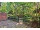 Private backyard with a stone patio and serene views of lush greenery at 17 Willow Ne Gln, Atlanta, GA 30342