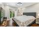Cozy bedroom featuring hardwood floors, ample natural light, and comfortable furnishings at 17 Willow Ne Gln, Atlanta, GA 30342