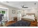 Spacious bedroom boasting hardwood floors, natural light, and a contemporary ceiling fan at 17 Willow Ne Gln, Atlanta, GA 30342