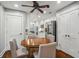 Breakfast nook with a wood table and four chairs with a ceiling fan, next to the kitchen at 17 Willow Ne Gln, Atlanta, GA 30342