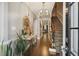 Entryway with hardwood floors, stairs to the right, and a mirror on the left, under a chandelier at 17 Willow Ne Gln, Atlanta, GA 30342