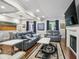 Living room with hardwood floors, two sofas, two side tables, and a fireplace with a TV above at 17 Willow Ne Gln, Atlanta, GA 30342