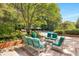 Relaxing pool area featuring comfortable seating surrounded by lush landscaping at 17 Willow Ne Gln, Atlanta, GA 30342