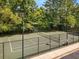 Well-maintained tennis court in a serene, wooded setting at 17 Willow Ne Gln, Atlanta, GA 30342