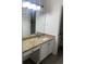 Bathroom vanity featuring a granite counter and a large mirror at 23210 Plantation Ne Dr, Atlanta, GA 30324
