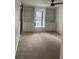 Bedroom featuring built-in shelving and a window with a view of the street at 23210 Plantation Ne Dr, Atlanta, GA 30324