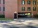 Brick building with covered parking, offering convenient and protected vehicle storage at 23210 Plantation Ne Dr, Atlanta, GA 30324