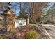 The Summit's stone entrance featuring well maintained landscaping creates a welcoming community entrance at 5153 Roswell Rd # 10, Atlanta, GA 30342