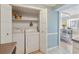 A convenient laundry area houses full size washer and dryer in a utility closet at 5153 Roswell Rd # 10, Atlanta, GA 30342