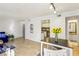 Bright living room features an open floor plan, light wood floors, and neutral color palette at 5153 Roswell Rd # 10, Atlanta, GA 30342