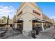 A sunny view of a Chipotle restaurant with outdoor seating and large windows at 5153 Roswell Rd # 10, Atlanta, GA 30342