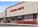 Exterior facade of a Trader Joe's store, red shopping carts lined outside of the store at 5153 Roswell Rd # 10, Atlanta, GA 30342
