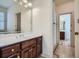 Bathroom featuring a white vanity with dark wood cabinets and a view into another bathroom at 1725 Patriots Nw Way, Kennesaw, GA 30152