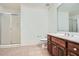 Well-lit bathroom with a glass-enclosed shower and a vanity with a white countertop at 1725 Patriots Nw Way, Kennesaw, GA 30152