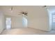 Spacious bonus room with neutral carpet, angled ceilings, and a ceiling fan at 1725 Patriots Nw Way, Kennesaw, GA 30152