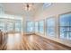 Bright breakfast room with vaulted ceiling, multiple windows, and adjacent to a modern kitchen at 1725 Patriots Nw Way, Kennesaw, GA 30152