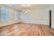 Formal dining room featuring hardwood floors, wainscoting, and window with shutters at 1725 Patriots Nw Way, Kennesaw, GA 30152