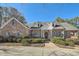 Beautiful brick home with symmetrical design, dormer windows and manicured landscaping at 1725 Patriots Nw Way, Kennesaw, GA 30152