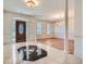 Elegant foyer with marble tile, chandelier, and view into a formal living space at 1725 Patriots Nw Way, Kennesaw, GA 30152