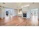 Spacious living room featuring hardwood floors, fireplace and built-in shelving at 1725 Patriots Nw Way, Kennesaw, GA 30152