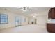 Bright living room featuring recessed lights, ceiling fans, a wet bar, and French doors leading outside at 1725 Patriots Nw Way, Kennesaw, GA 30152