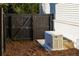 Backyard with a generator next to the house at 2629 Ashford Ne Rd, Brookhaven, GA 30319