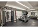 Home gym equipped with modern fitness equipment including a treadmill, weight machines, and free weights at 2629 Ashford Ne Rd, Brookhaven, GA 30319