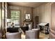 Traditional-style home office with custom built-ins, a fireplace, and large window providing natural light at 2629 Ashford Ne Rd, Brookhaven, GA 30319