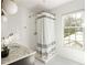 Bathroom showcasing a shower with white subway tiles, grey curtain, and patterned floors at 2629 Ashford Ne Rd, Brookhaven, GA 30319