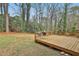 Relaxing backyard features a wooden deck with a view of the wooded surroundings at 2941 Pine Valley Cir, East Point, GA 30344