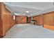 Large basement area featuring wood paneling, a staircase, and ample open space ready for customization at 2941 Pine Valley Cir, East Point, GA 30344