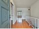 Entryway with hardwood floors, white walls, and a view of a room with bright windows at 2941 Pine Valley Cir, East Point, GA 30344