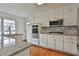 Modern kitchen featuring stainless steel appliances, granite counters, and mosaic backsplash at 2941 Pine Valley Cir, East Point, GA 30344