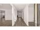 Open hallway featuring wood flooring and natural light at 310 Aspen Valley Dr, Loganville, GA 30052