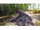 Winding walking trail through a wooded area, perfect for enjoying nature at 310 Aspen Valley Dr, Loganville, GA 30052