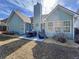 View of the back of the house with patio area and outdoor furniture with a grill at 530 Firethorn Ct, Villa Rica, GA 30180