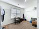 Carpeted walk-in closet features a window, shelving, and a desk for added convenience at 530 Firethorn Ct, Villa Rica, GA 30180