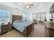 Serene main bedroom featuring a tray ceiling, plush carpet, and an abundance of natural light at 530 Firethorn Ct, Villa Rica, GA 30180